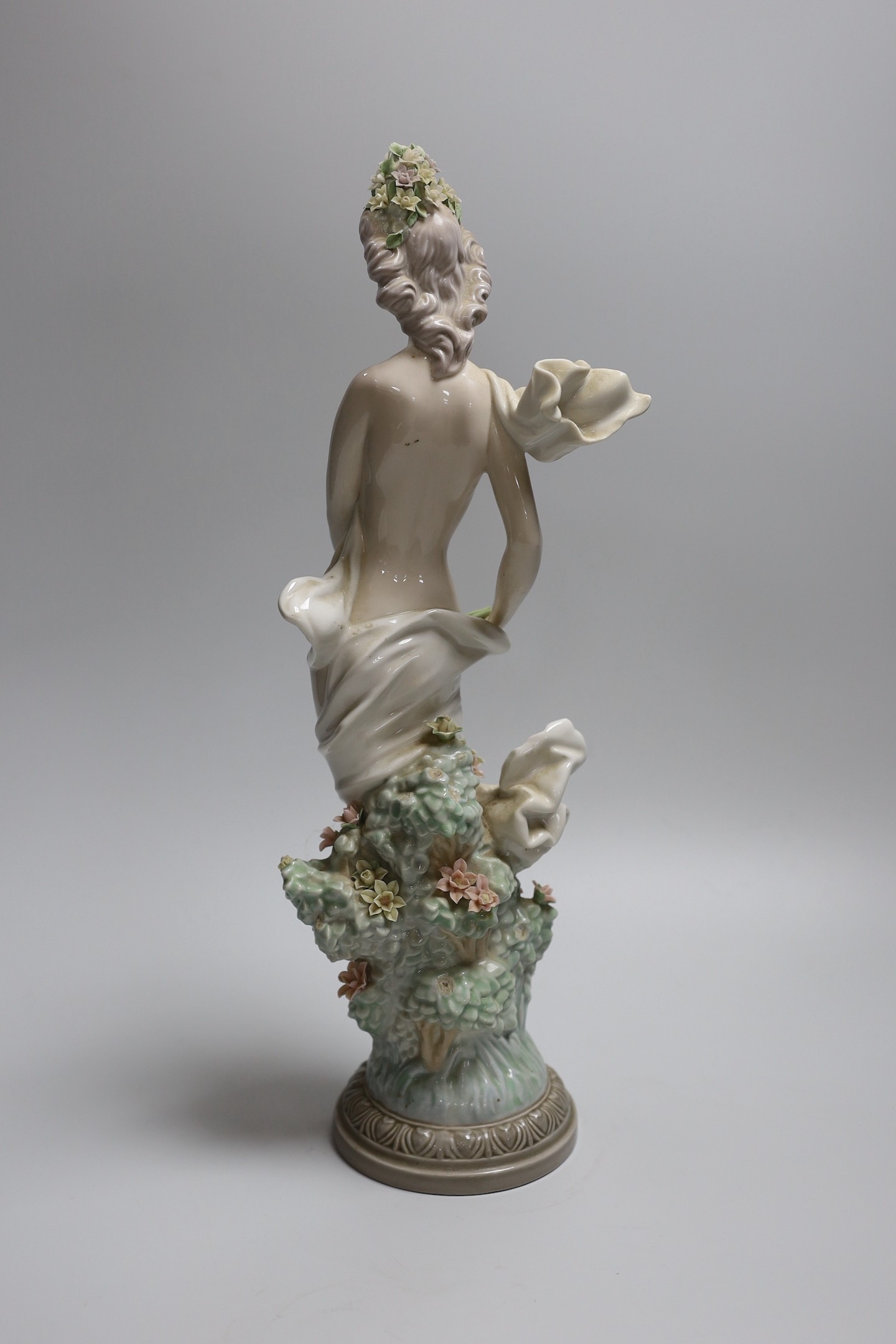 A Lladro figure of a maiden, decorators signature on base, No 401, 41cms